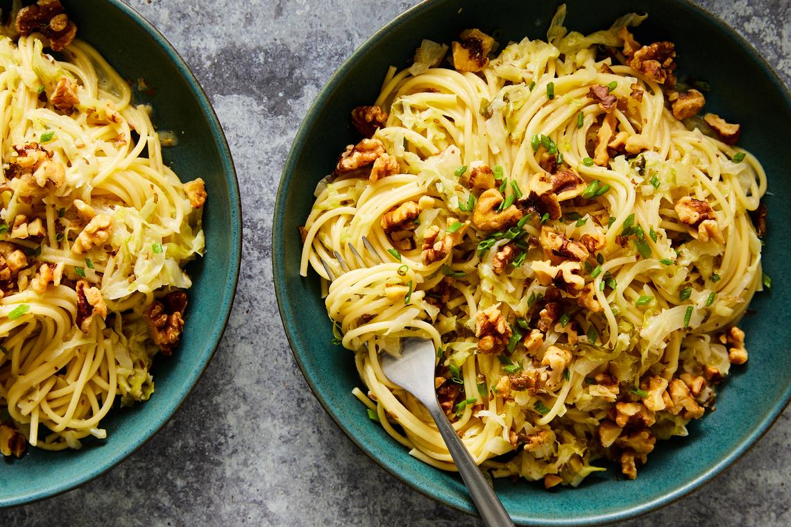 Caramelized cabbage and walnut pasta. Including a bean-based Japanese curry, Genevieve Ko's dan dan noodles and our very beloved chicken shawarma. Food Stylist: Barrett Washburne. (Ryan Liebe/The New York Times)