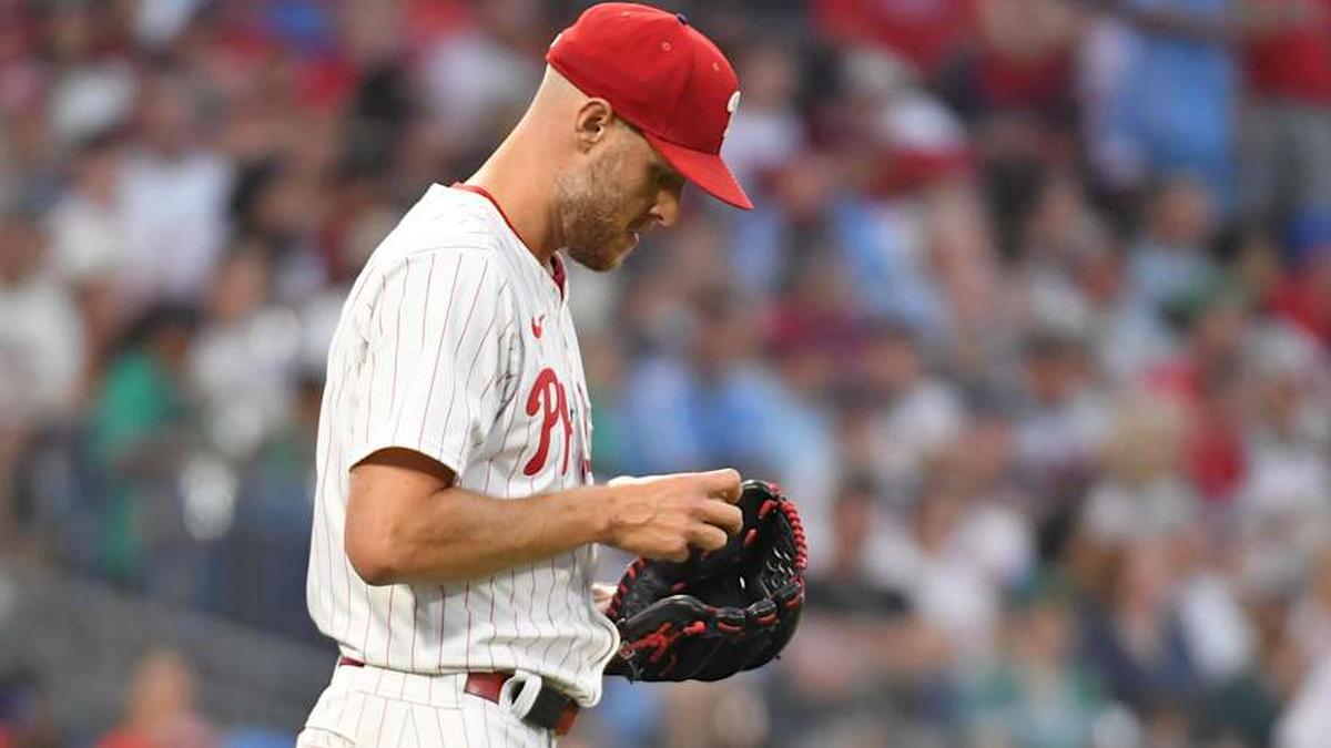  Jul 21, 2025; Philadelphia, Pennsylvania, USA; Philadelphia Phillies pitcher Zack Wheeler (45) checks the baseball after allowing a run during the sixth inning against the Boston Red Sox at Citizens Bank Park. | Eric Hartline-Imagn Images 