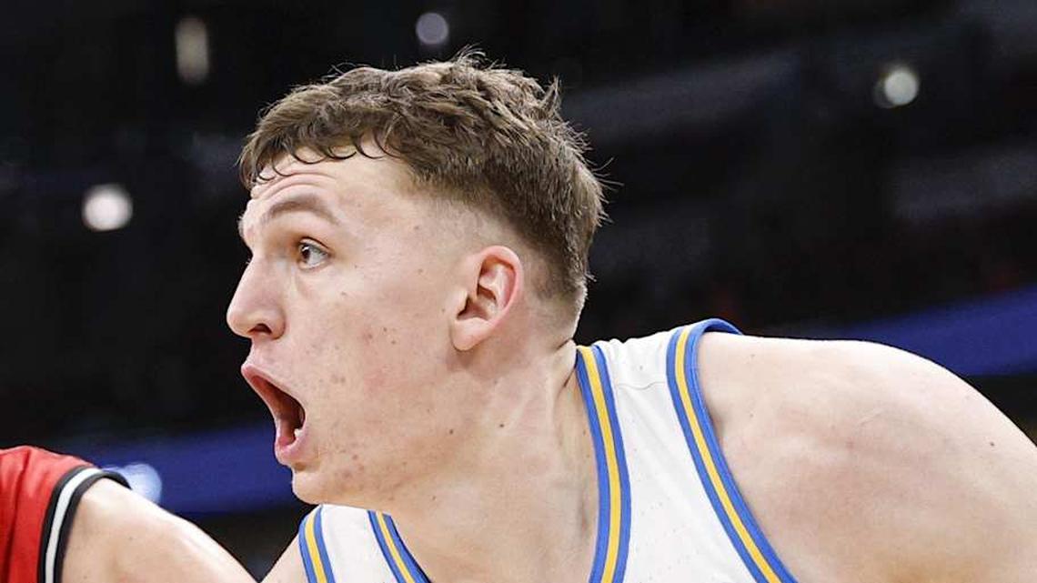  Mar 12, 2026; Chicago, IL, USA; UCLA Bruins forward Tyler Bilodeau (34) drives to the basket against Rutgers Scarlet Knights guard Harun Zrno (13) during the second half at United Center. Mandatory Credit: Kamil Krzaczynski-Imagn Images | Kamil Krzaczynski-Imagn Images 