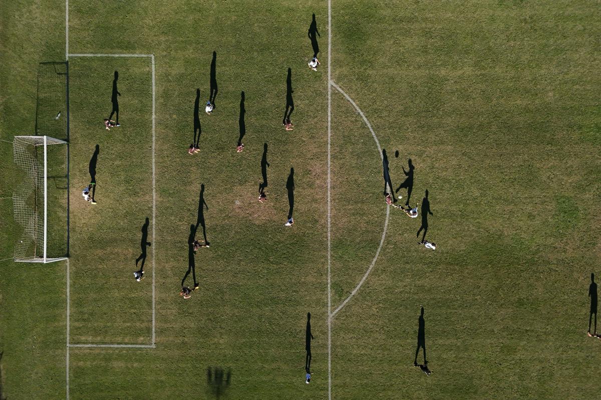 A drone view of San Miguel de Las Heras players during a soccer match, as part of the regional semi-amateur Liga de Lobos tournament, in which some players are paid per game, in General Las Heras, Buenos Aires province, Argentina, April 12, 2026. For three-time World Cup champions Argentina, football is a feverish passion that permeates every home. REUTERS/Agustin Marcarian