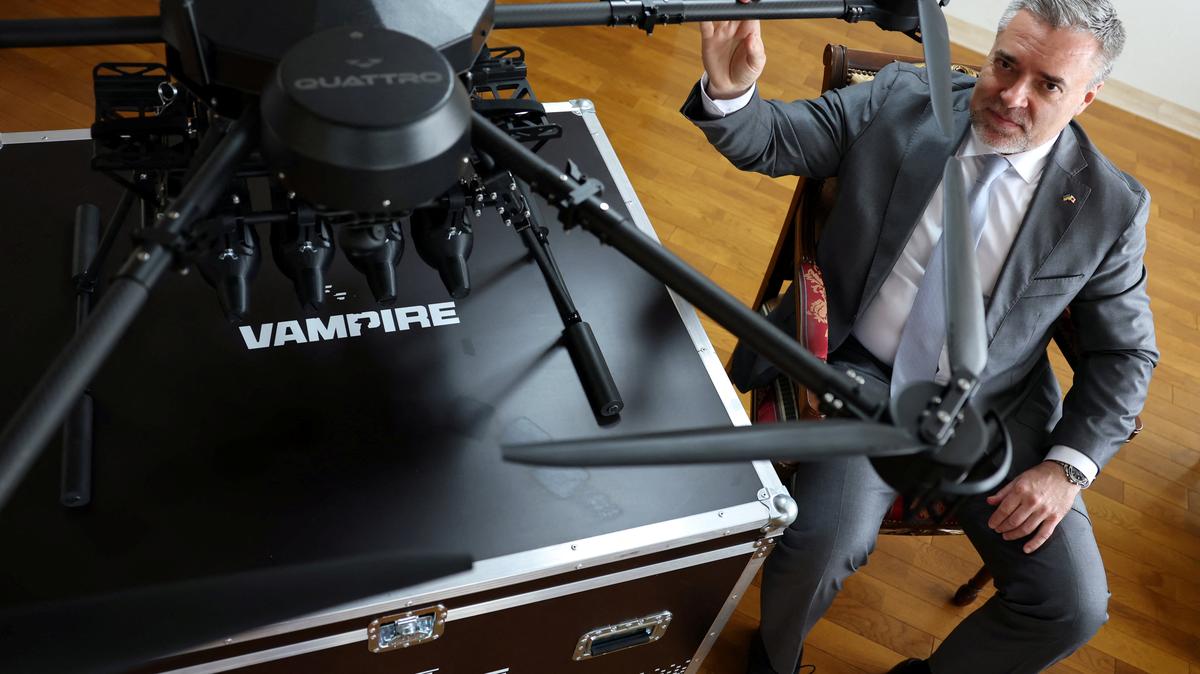 Ukraine's Ambassador to Japan Yurii Lutovinov poses for a photograph next to a mockup of Ukrainian-made Vampire drone during an interview with Reuters at Ukraine Embassy in Tokyo, Japan April 28, 2026.  REUTERS/Issei Kato