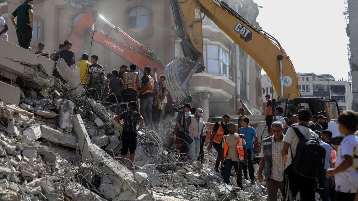 Dozens trapped as Gaza building collapses killing 11