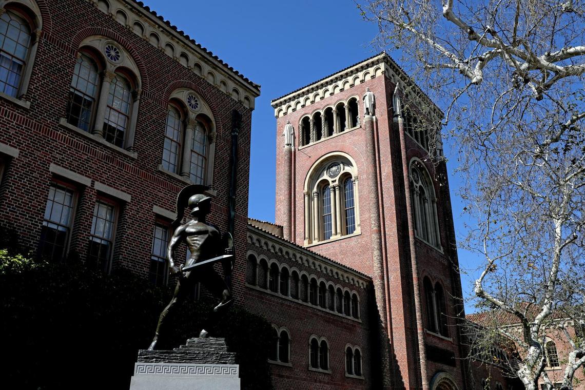 Bovard Administration Building with Tommy Trojan on the Campus of the University of Southern California on Tuesday, March 28, 2023 in Los Angeles.