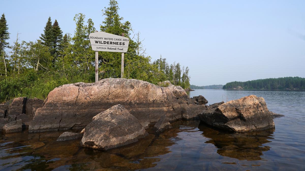 A sign in Seagull Lake marks an entrance to the Boundary Waters Canoe Area Wilderness in Cook County, Minnesota. Congress’ move to allow mining in the state’s Superior National Forest near the wilderness area may have broad ramifications across the country.