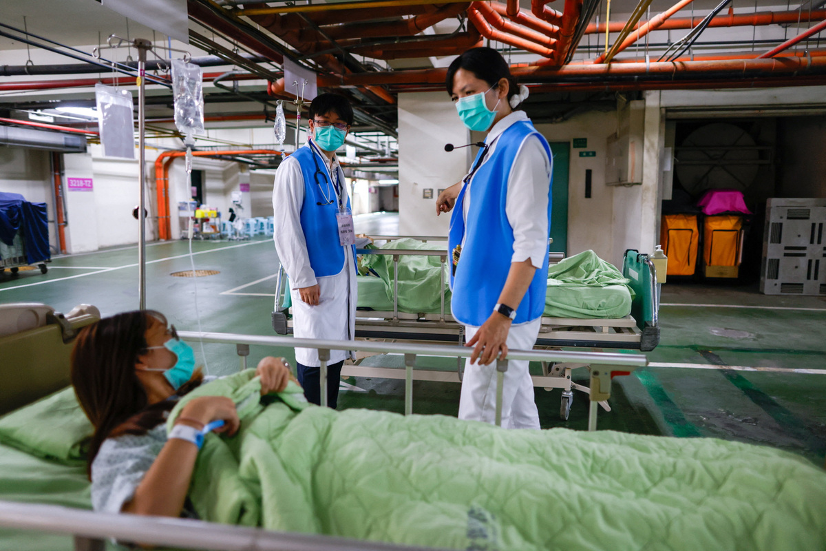 Medical staffs check on a patient in an underground parking lot converted into a temporary medical ward during a resilience drill in Nantou, Taiwan, July 2, 2026. REUTERS/Ann Wang