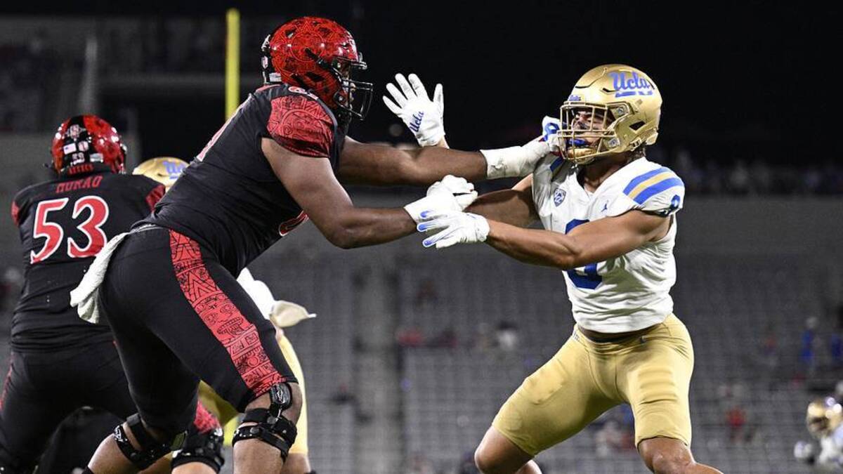  Sep 9, 2023; San Diego, California, USA; UCLA Bruins linebacker Choe Bryant-Strother (9) battles with San Diego State Aztecs offensive lineman Brandon Crenshaw-Dickson (61) during the second half at Snapdragon Stadium. Mandatory Credit: Orlando Ramirez-Imagn Images | Orlando Ramirez-Imagn Images 