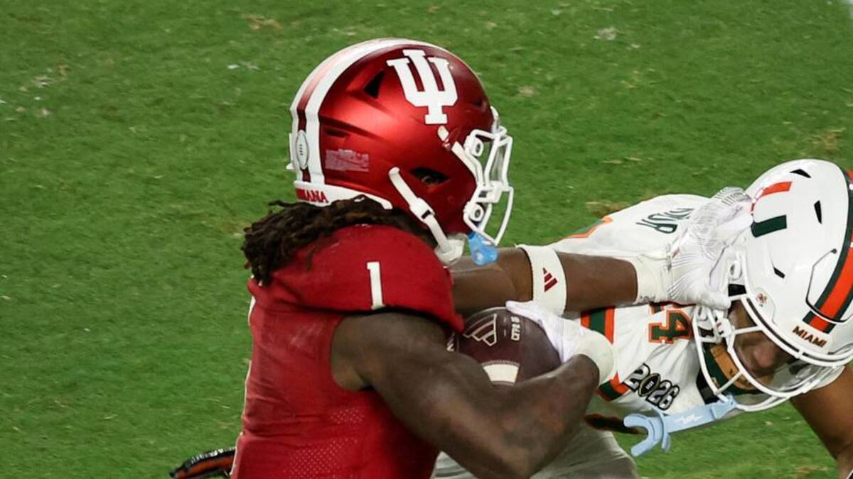  Jan 19, 2026; Miami Gardens, FL, USA; Indiana Hoosiers running back Roman Hemby (1) carries the ball defended by Miami Hurricanes defensive back Ethan O'Connor (24) in the fourth quarter during the College Football Playoff National Championship game at Hard Rock Stadium. Mandatory Credit: Kim Klement Neitzel-Imagn Images | Kim Klement Neitzel-Imagn Images 