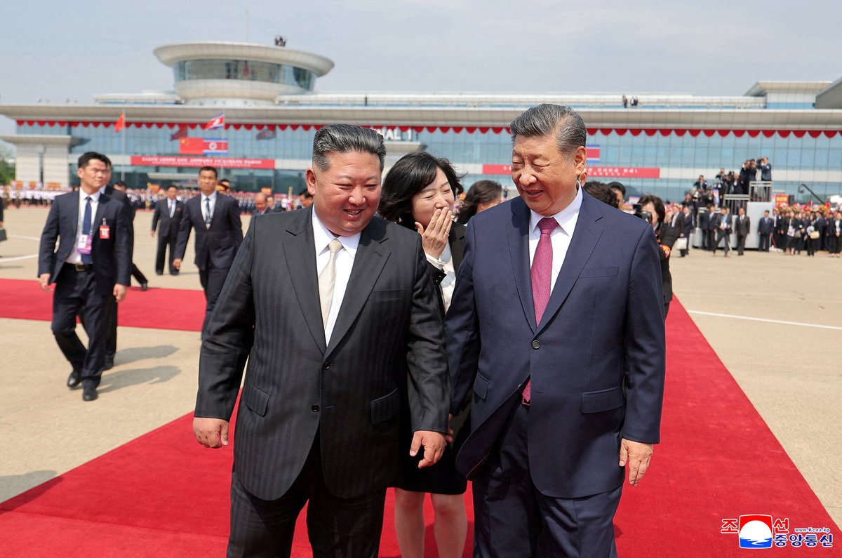 Chinese President Xi Jinping walks with North Korean leader Kim Jong Un as Xi Jinping departs following his state visit to Pyongyang, North Korea, June 9, 2026. KCNA via REUTERS