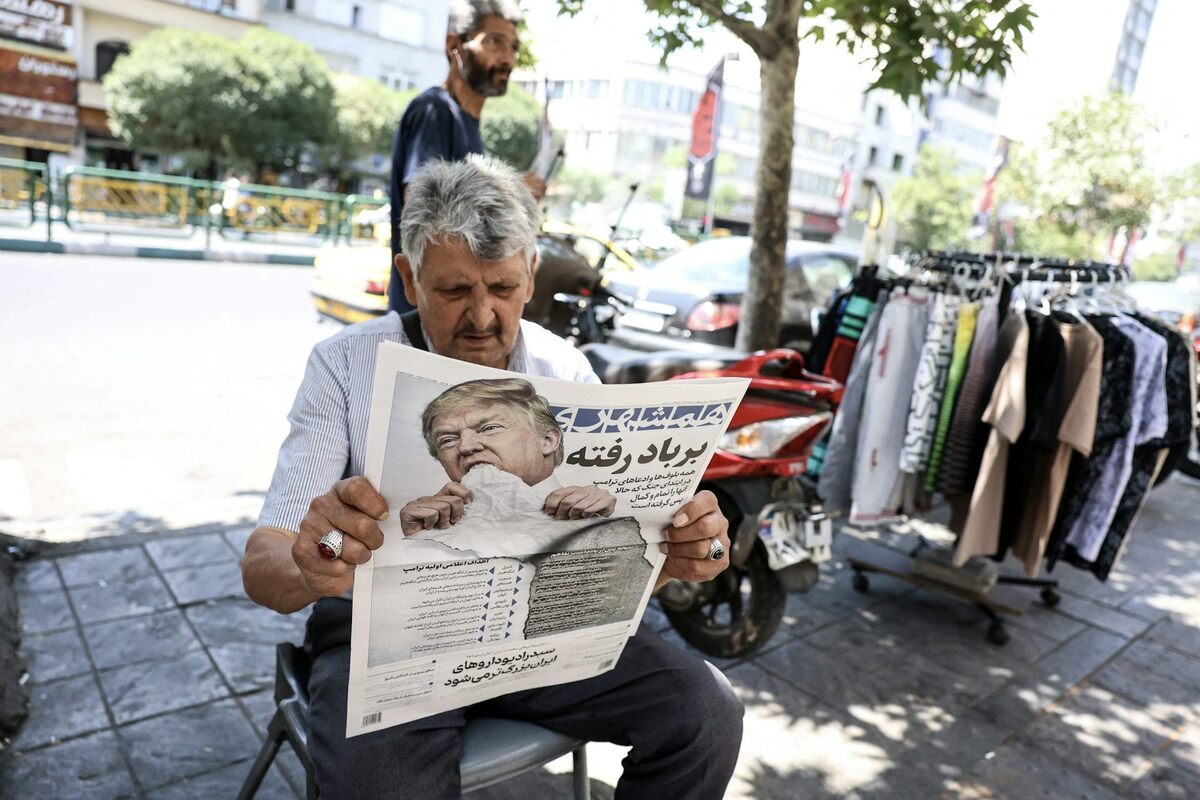  A man reads a newspaper bearing an image of the U.S. president and a headline that reads ‘Gone with the wind' in Tehran on June 18, 2026. AFP via Getty Images 