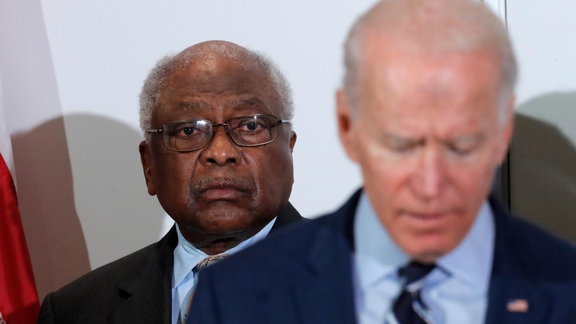 FILE - House Majority Whip, Rep. Jim Clyburn, D-S.C., background, listens as Democratic presidential candidate former Vice President Joe Biden, speaks at an event in North Charleston, S.C., Feb. 26, 2020. (AP Photo/Gerald Herbert, File)