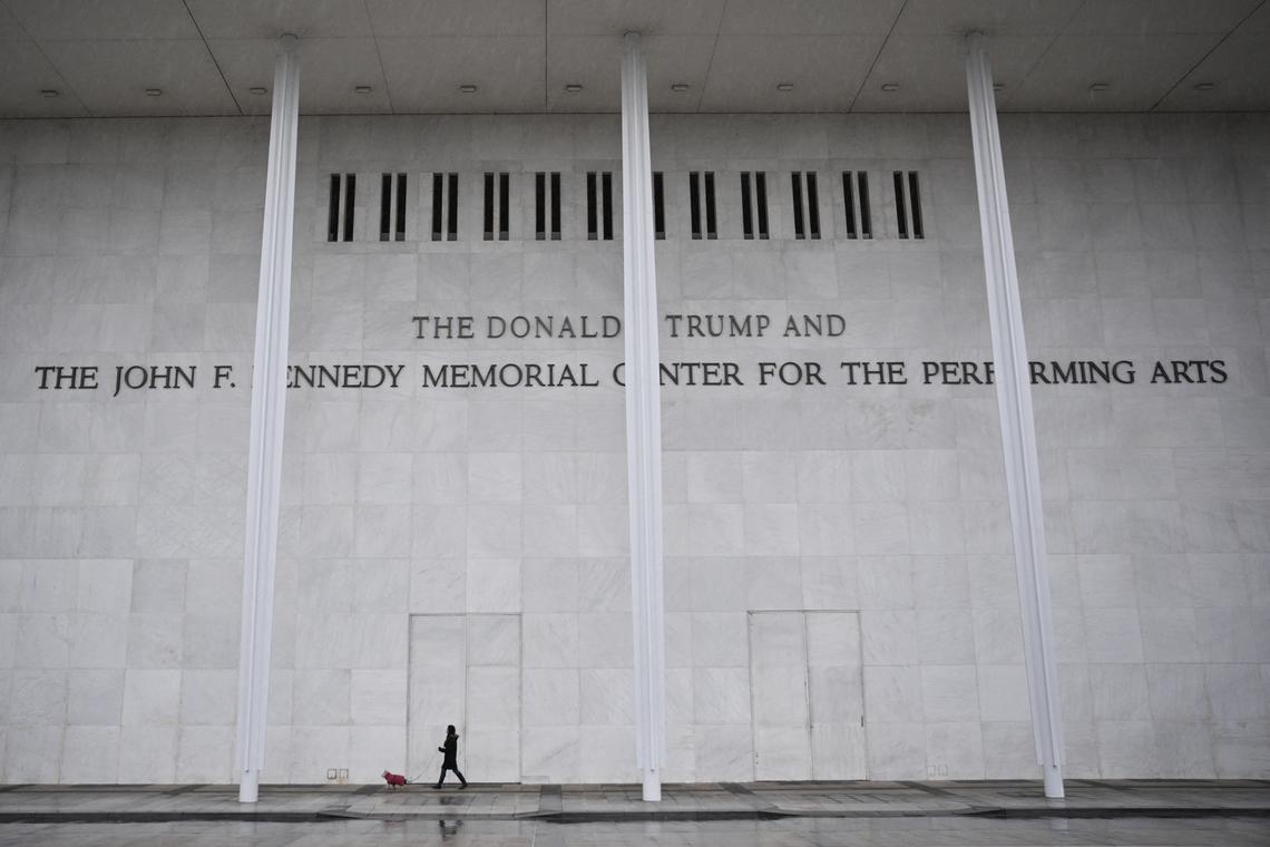  A person and a dog walk in front of the John F. Kennedy Center for the Performing Arts in Washington, D.C., on January 10, 2026. 