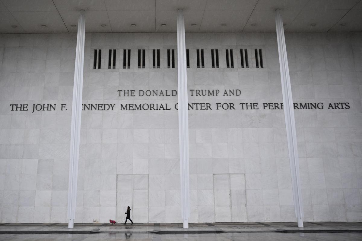  A person and a dog walk in front of the John F. Kennedy Center for the Performing Arts in Washington, D.C., on January 10, 2026. 