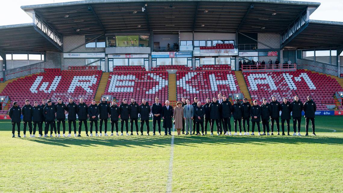 Britain’s King Charles III and Camilla, the Queen Consort meet Wrexham Soccer team co owners, US actors Ryan Reynolds and Rob McElhenney and players during their visit to Wrexham Association Football Club’s Racecourse Ground, in Wrexham, England, Friday, Dec. 9, 2022.