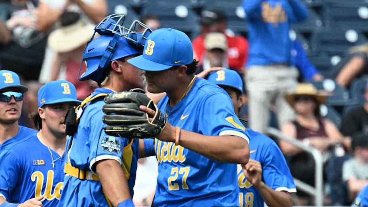  Jun 14, 2025; Omaha, Neb, USA; UCLA Bruins pitcher Easton Hawk (27) celebrates with catcher Cashel Dugger (40) after the win against the Murray State Racers at Charles Schwab Field. Mandatory Credit: Steven Branscombe-Imagn Images | Steven Branscombe-Imagn Images 