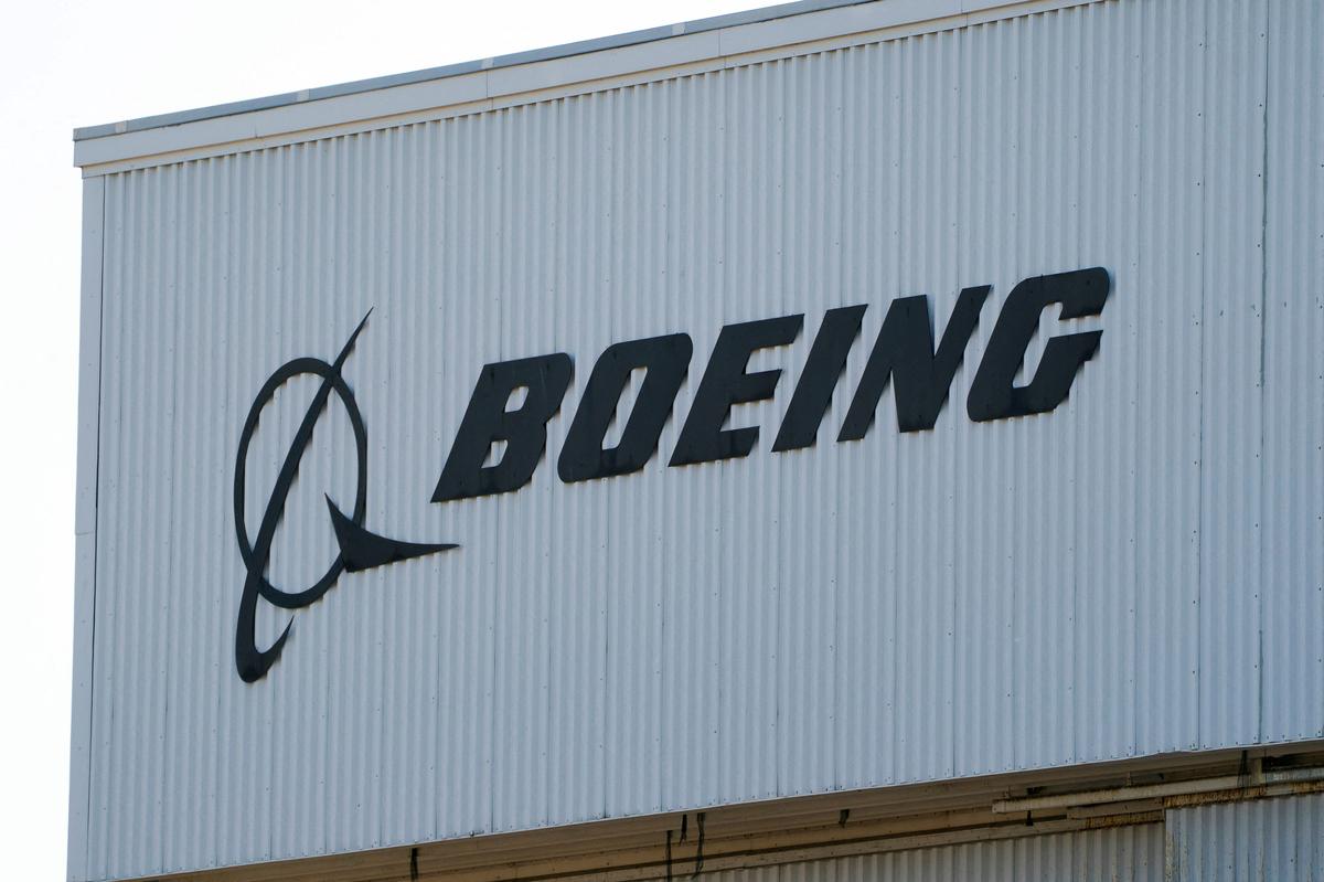 FILE PHOTO: A Boeing sign sits on a building near Boeing Field, as trade tensions escalate over U.S. tariffs with China, in Seattle, Washington, U.S. April 22, 2025.  REUTERS/David Ryder/File Photo