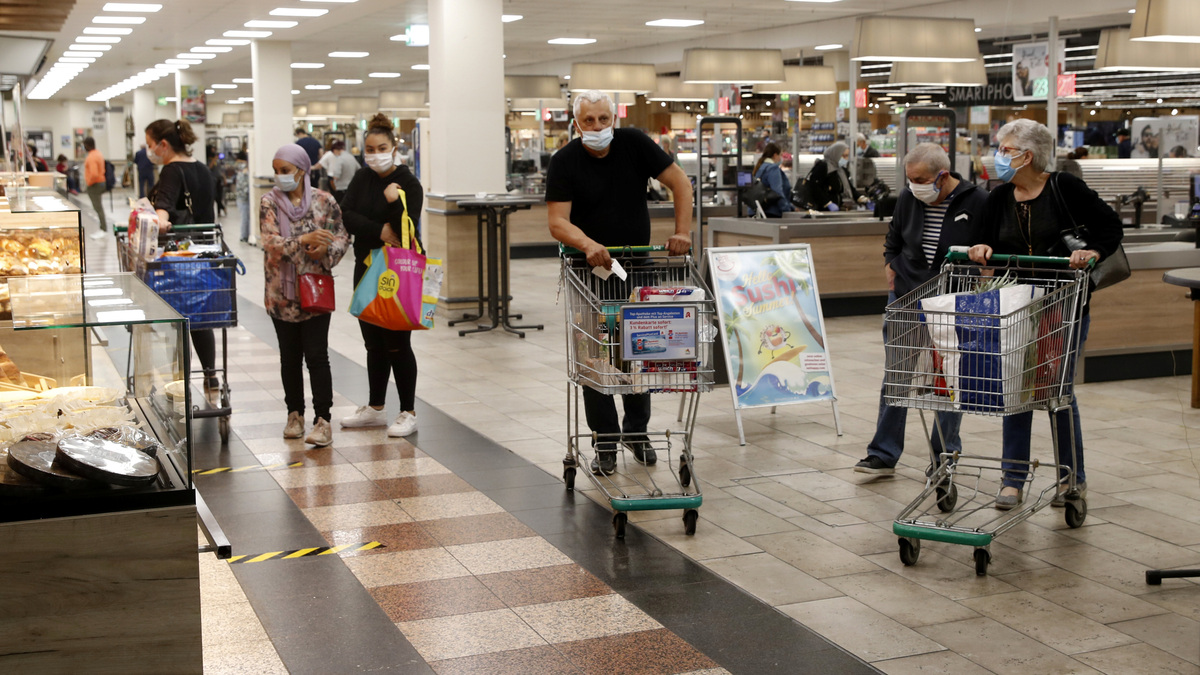 People are seen in a supermarket at the Rhein Center shopping mall in Weil am Rhein, Germany June 15, 2020.     REUTERS/Arnd Wiegmann