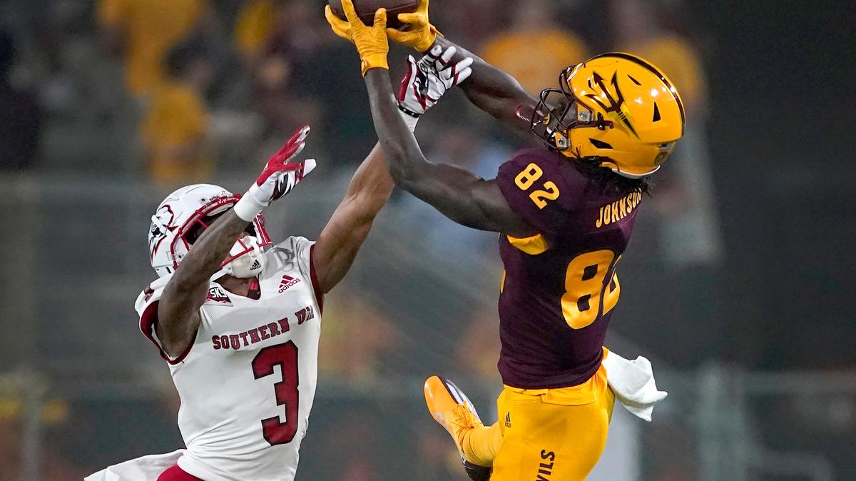 Arizona State wide receiver Andre Johnson (82) pulls in a pass as Southern Utah cornerback Kobe Singleton (3) defends during the first half of an NCAA college football game, Thursday, Sept. 2, 2021, in Tempe, Ariz. (AP Photo/Matt York)