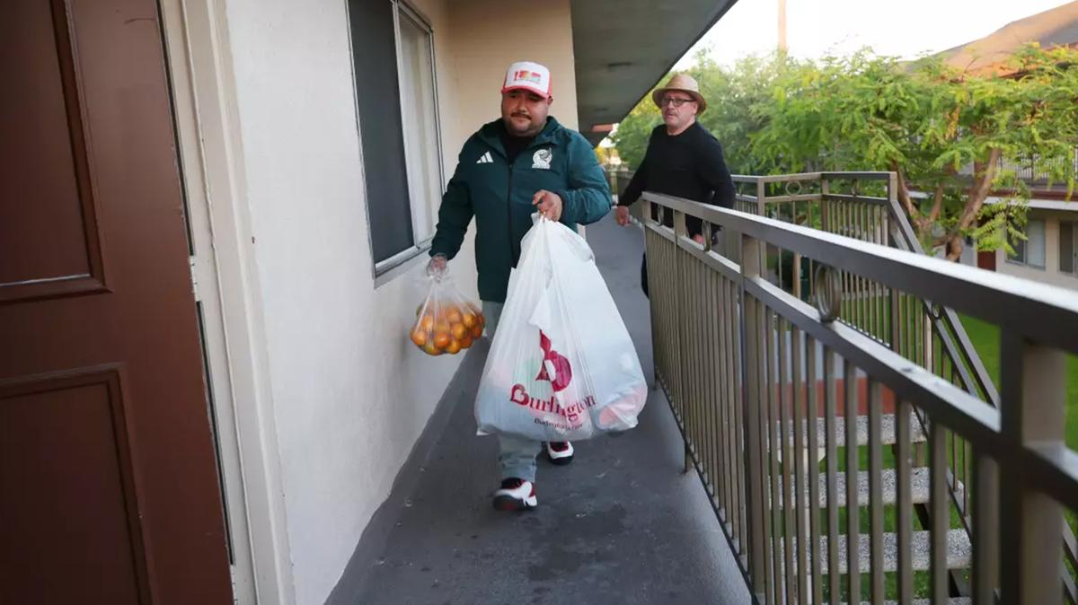 Allan Chaidez and his father, Guillermo Chaidez, return home to Stanton on Monday after the chemical crisis at an aerospace company in Garden Grove forced them to evacuate. (Jason Armond/Los Angeles Times/TNS)