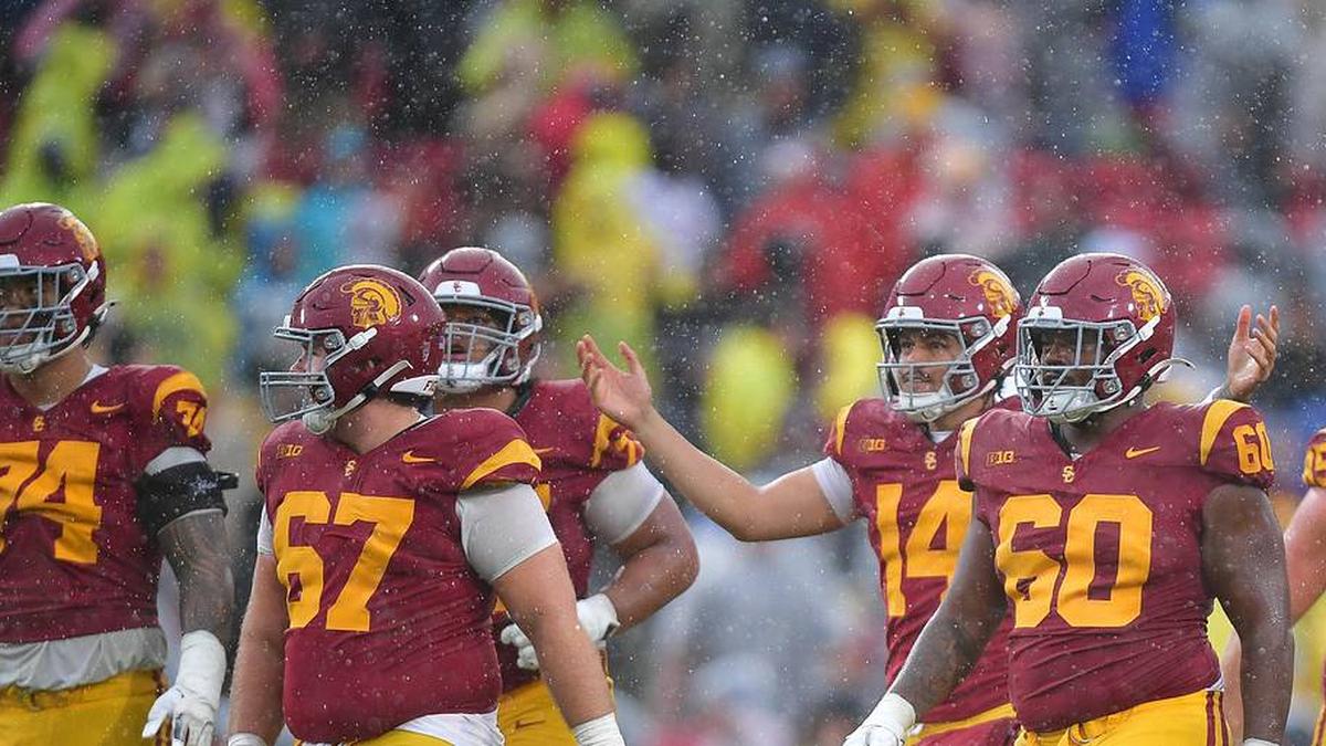  Nov 15, 2025; Los Angeles, California, USA; Southern California Trojans quarterback Jayden Maiava (14) celebrates the victory against the Iowa Hawkeyes at the Los Angeles Memorial Coliseum. Mandatory Credit: Gary A. Vasquez-Imagn Images | Gary A. Vasquez-Imagn Images 