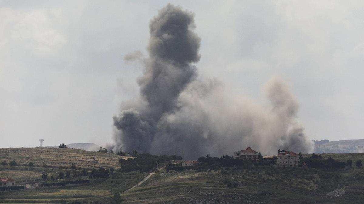 Smoke billows from southern Lebanon following an Israeli strike, as seen from Marjeyoun, Lebanon, May 15, 2026. REUTERS/Stringer