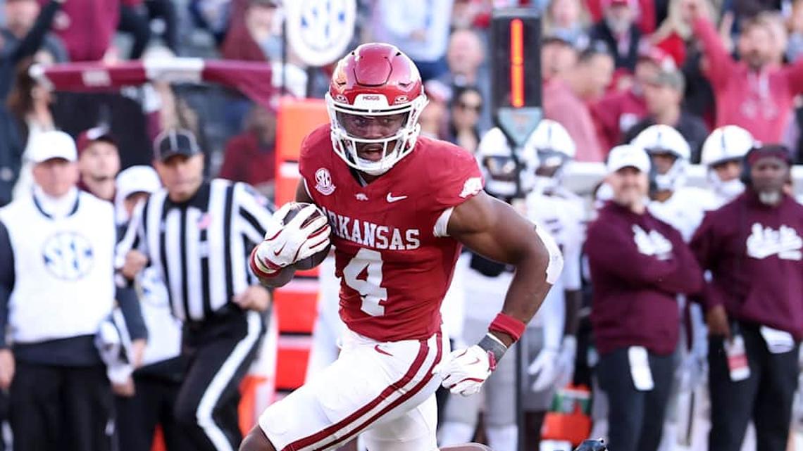  Nov 1, 2025; Fayetteville, Arkansas, USA; Arkansas Razorbacks running back Mike Washington Jr (4) rushes for a touchdown during the third quarter against the Mississippi State Bulldogs at Donald W. Reynolds Razorback Stadium. Bulldogs won 38-35. Mandatory Credit: Nelson Chenault-Imagn Images | Nelson Chenault-Imagn Images 