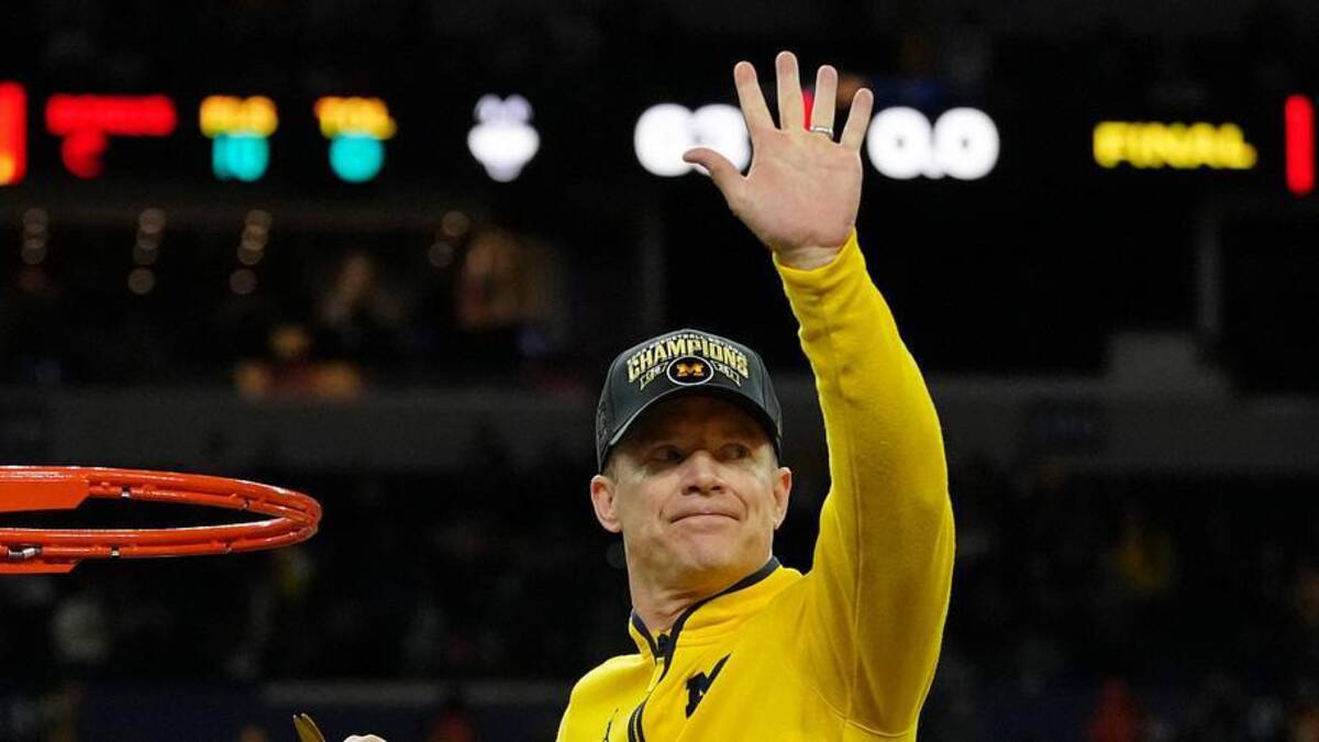  Apr 6, 2026; Indianapolis, IN, USA; Michigan Wolverines head coach Dusty May waves to fans before cutting the net after their win against the UConn Huskies in the national championship of the Final Four of the men's 2026 NCAA Tournament between the and the Michigan Wolverines at Lucas Oil Stadium. Mandatory Credit: Bob Donnan-Imagn Images | Bob Donnan-Imagn Images 