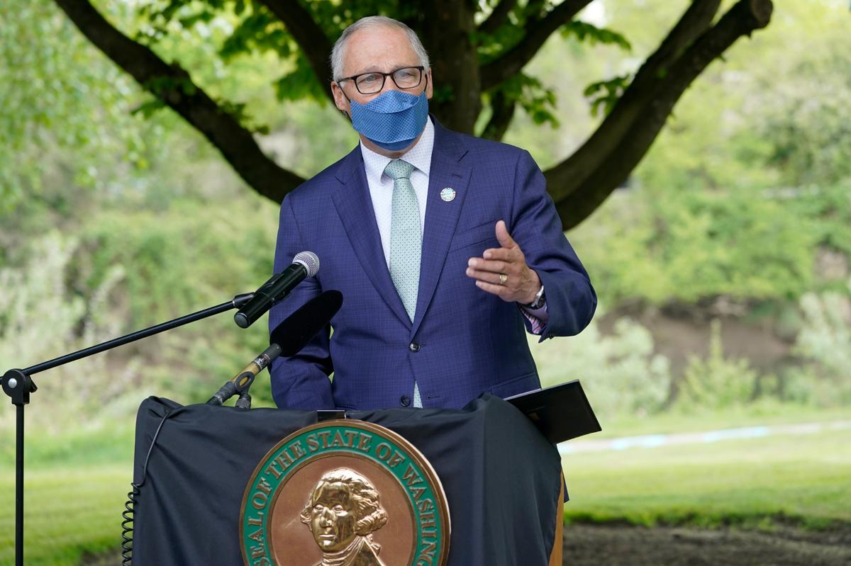 Washington Gov. Jay Inslee speaks before signing a bill into law in Tukwila, Wash., Tuesday, May 4, 2021.