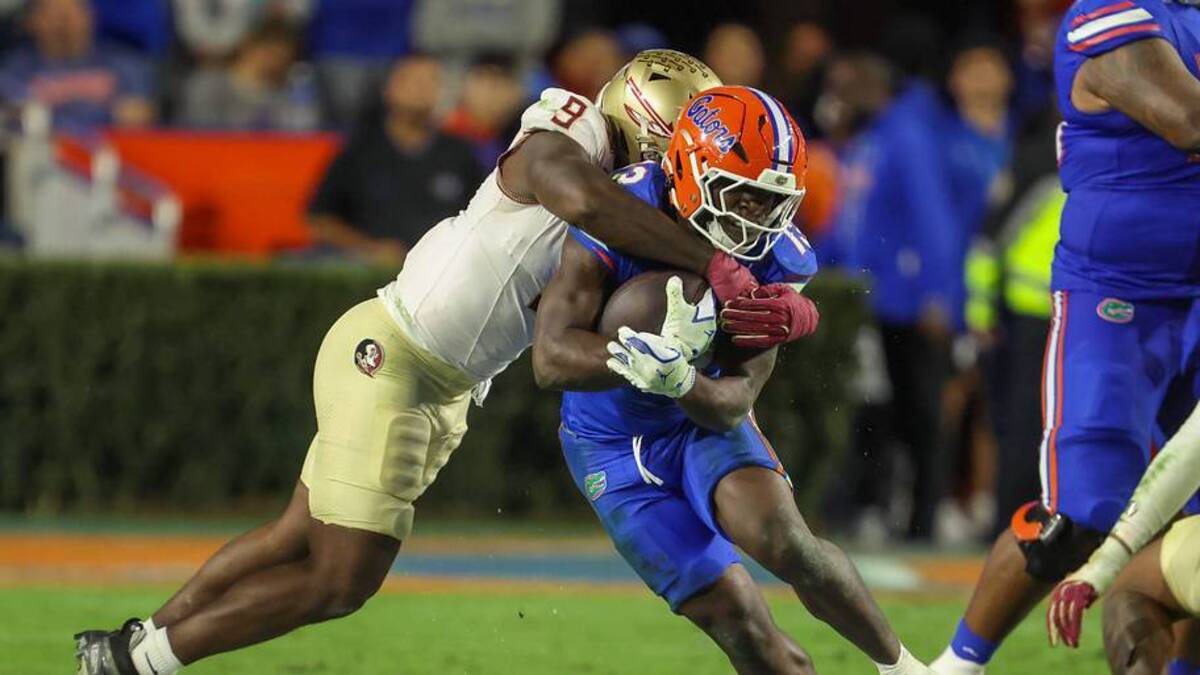  Florida quarterback Harrison Bailey (15) gets tackled by Florida State linebacker Omar Graham Jr. (9) during the second half of an NCAA football game at Steve Spurrier Field at Ben Hill Griffin Stadium in Gainesville, FL on Saturday, November 29, Florida beat Florida State 40-21.2025. [Alan Youngblood/Gainesville Sun] | USA TODAY Network via Reuters Connect 