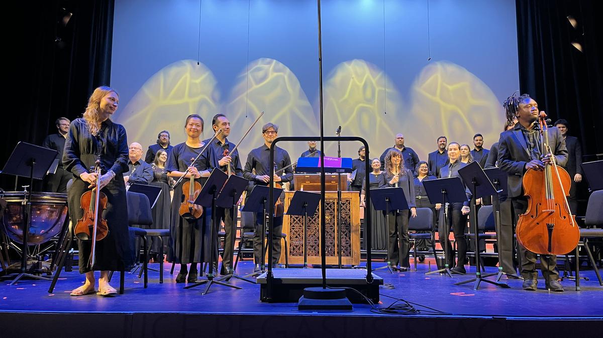 Orlando Sings' Solaria Singers and Solaria Players chamber orchestra stand for a curtain call at the end of Saturday afternoon's "Voice and Flame" concert in the Pugh Theater at the Dr. Phillips Center for the Performing Arts. (Matthew J. Palm/Orlando Sentinel)