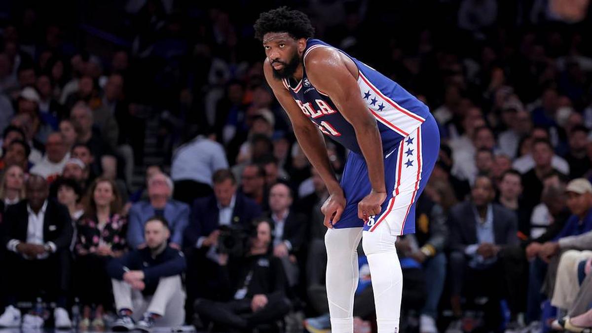  76ers center Joel Embiid reacts during the first quarter of Game 1 of against the Knicks. | Brad Penner-Imagn Images 