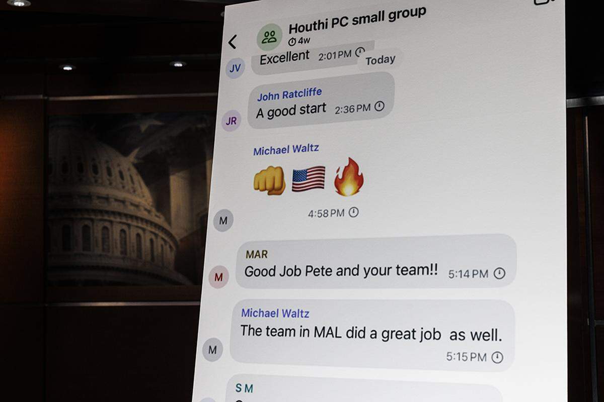 A poster of the Signal group chat of Trump administration officials discussing an upcoming strike against Houthi positions is seen during a House Democratic news conference in the Capitol Building in Washington on Tuesday, March 25, 2025. Democrats are calling for investigations and resignations after a reporter was inadvertently added to the group chat.
