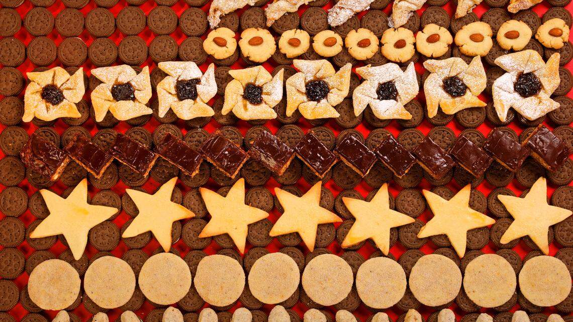 Christmas cookies from around the world are photographed on Wednesday, Nov. 20, 2019, in the Post-Dispatch studio. Featured are, from top, Vienna Tarts, Almond Shortbread Cookies, Joulutorttu (pinwheels), Chocolate-Glazed Lebkuchen, Mailanderli, Biscochitos and Vanilla Kipferl.(Christian Gooden/St. Louis Post-Dispatch/TNS)