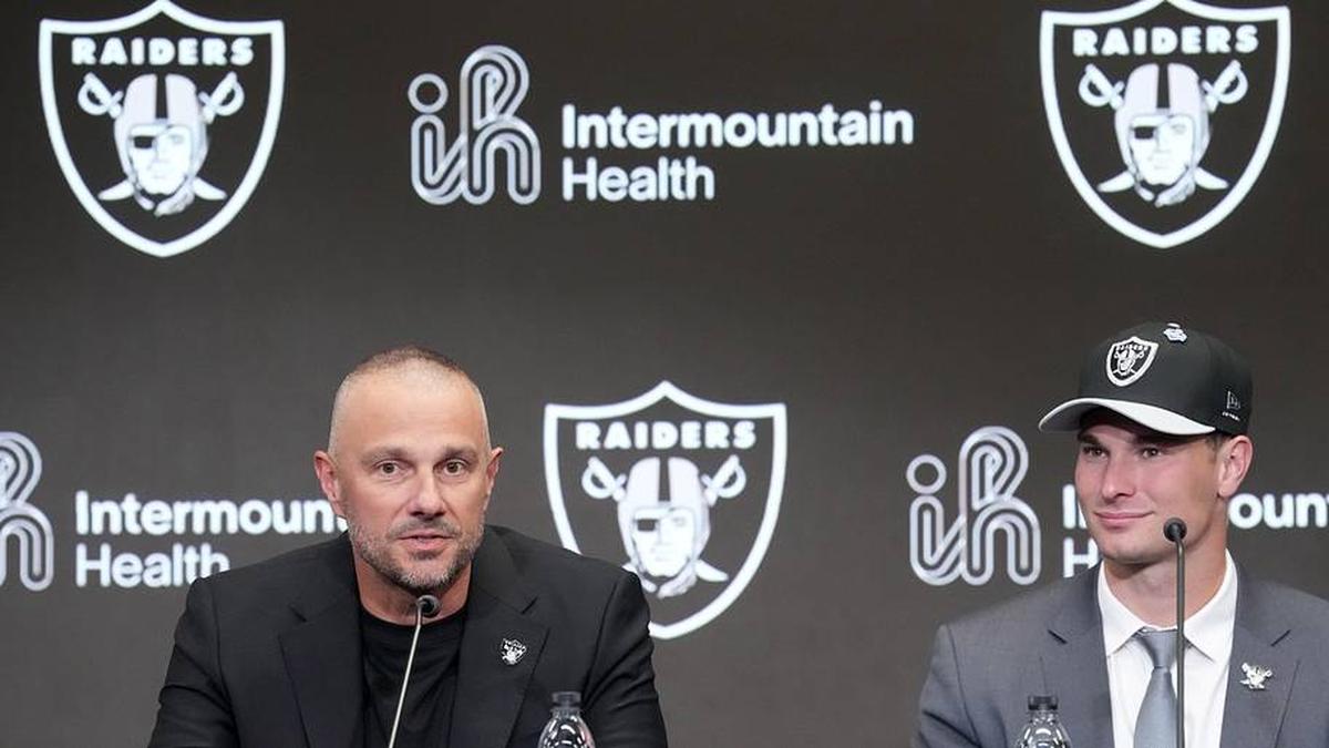  Apr 24, 2026; Henderson, NV, USA; Las Vegas Raiders quarterback Fernando Mendoza (right) and general manager John Spytek at introductory press conference at Intermountain Health Performance Center after being selected as the No. 1 pick in the 2026 NFL Draft. Mandatory Credit: Kirby Lee-Imagn Images | Kirby Lee-Imagn Images 