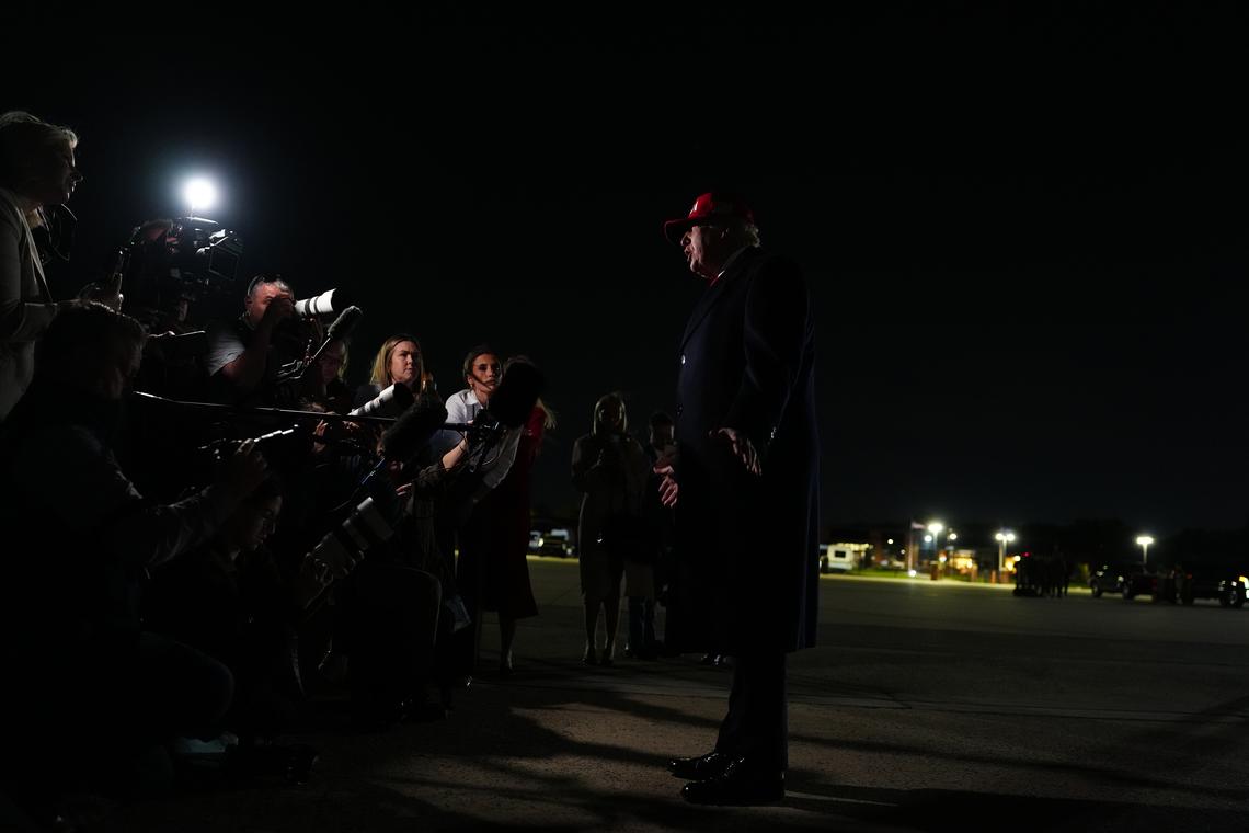 President Donald Trump speaks to reporters after disembarking Air Force One at Joint Base Andrews in Maryland, on Sunday, April 12, 2026. (Tierney L. Cross/The New York Times)