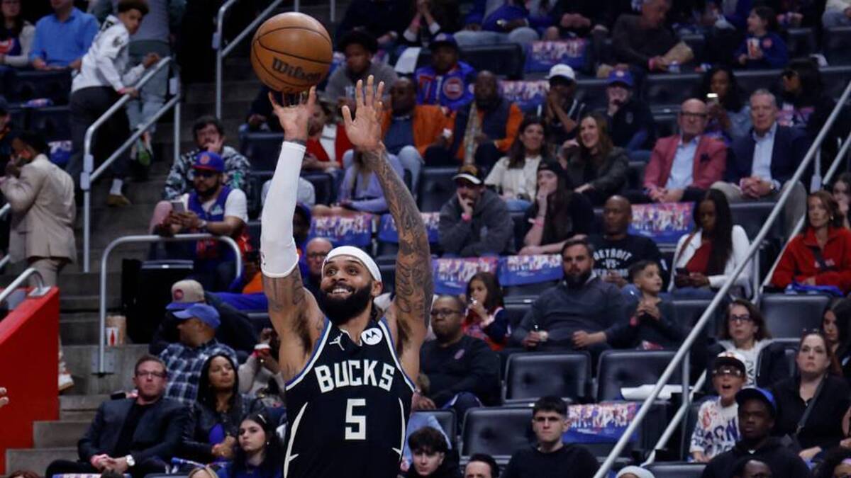  Apr 08, 2026; Detroit, Michigan, USA; Milwaukee Bucks guard Gary Trent Jr. (5) shoots the ball as Detroit Pistons forward Ron Holland II (5) defends in the second half at Little Caesars Arena. Mandatory Credit: Rick Osentoski-Imagn Images | IMAGN IMAGES via Reuters Connect 