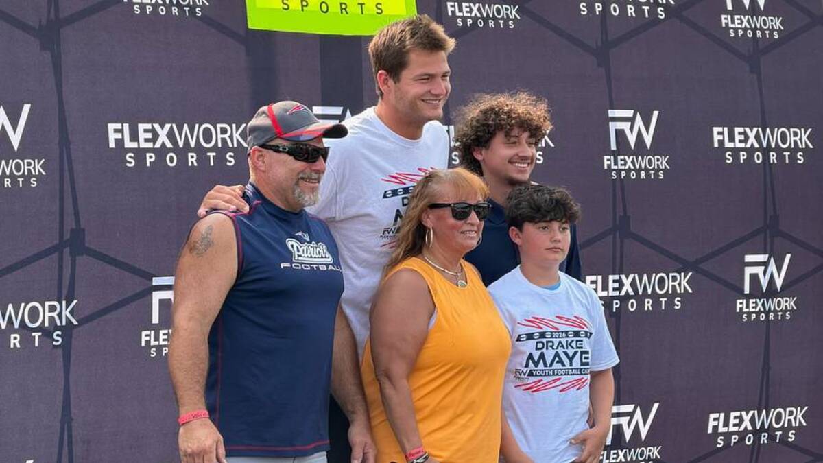  New England Patriots quarterback Drake Maye poses for photos at his youth camp in Mansfield, Mass. | Ethan Hurwitz / Patriots On SI 