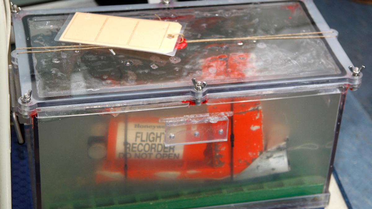 FILE PHOTO: The Cockpit Voice Recorder (CVR), one of two flight recorders from the Rio-Paris Air France flight which crashed in 2009, is carrying to be displayed for the media before a news conference at the BEA headquarters in Le Bourget, northern Paris, May 12, 2011.  REUTERS/Charles Platiau/File Photo