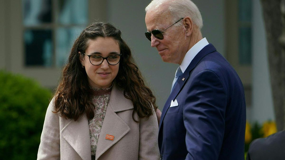 Mia Tretta, a Saugus High School shooting survivor and US President Joe Biden attend an event on measures to combat gun crime in the Rose Garden of the White House in Washington, D.C., on April 11, 2022. (Mandel Ngan/AFP via Getty Images/TNS)