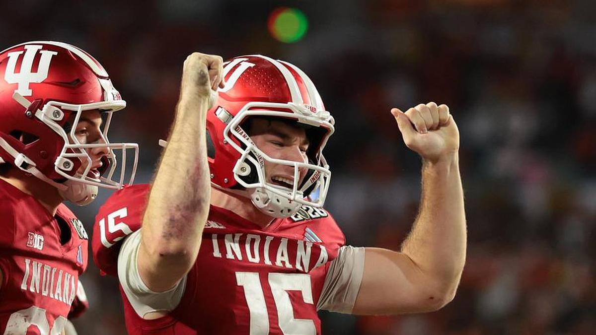  Jan 19, 2026; Miami Gardens, FL, USA; Indiana Hoosiers quarterback Fernando Mendoza (15) celebrates after scoring a touchdown against the Miami Hurricanes in the fourth quarter during the College Football Playoff National Championship game at Hard Rock Stadium. Mandatory Credit: Sam Navarro-Imagn Images | Sam Navarro-Imagn Images 