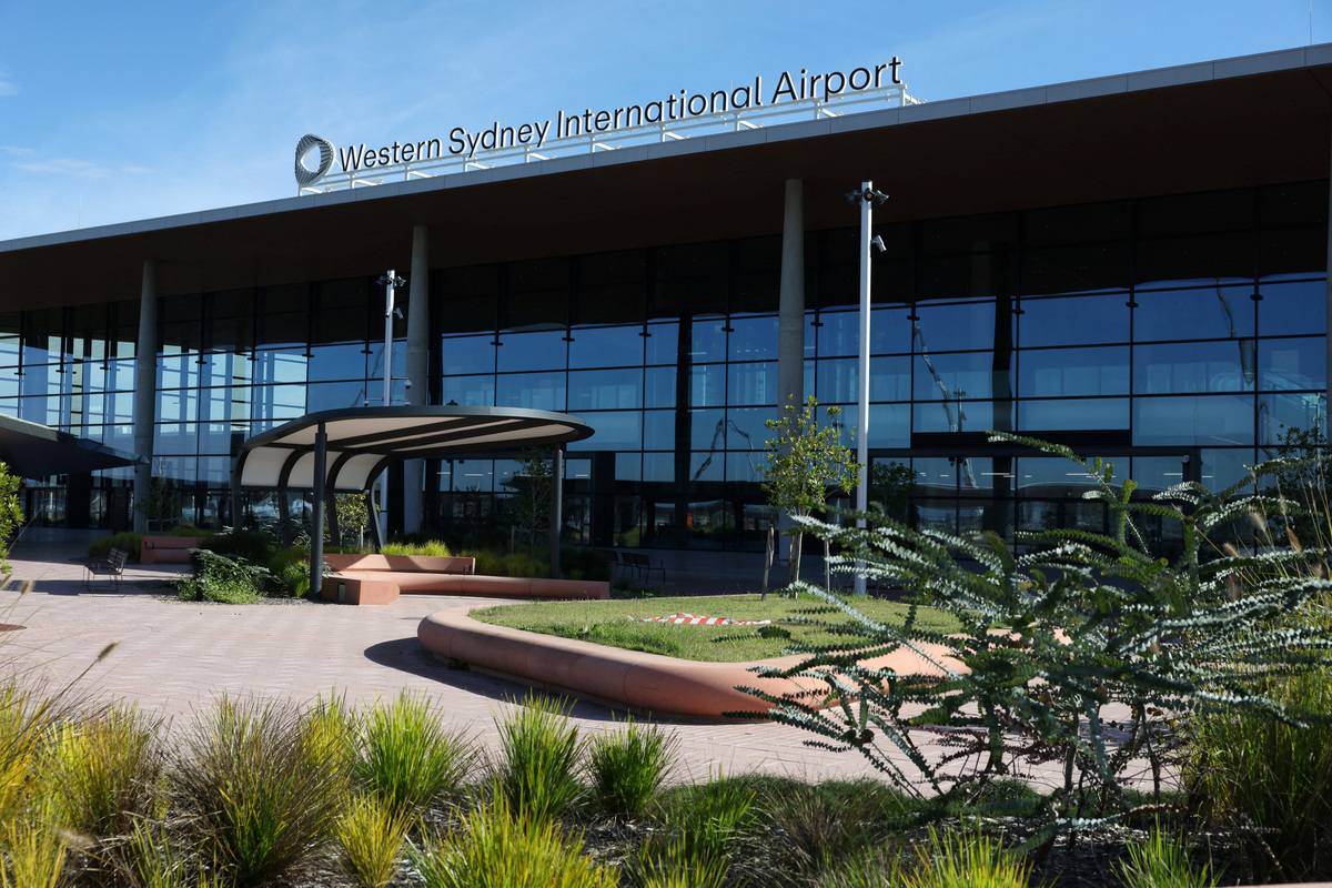 A sign stands on the roof of the new Western Sydney International Airport, after Qantas Airways and Jetstar announced they will launch commercial passenger services from the airport after its opening on October 25, in Luddenham, Western Sydney, Australia, June 10, 2026. REUTERS/Hollie Adams