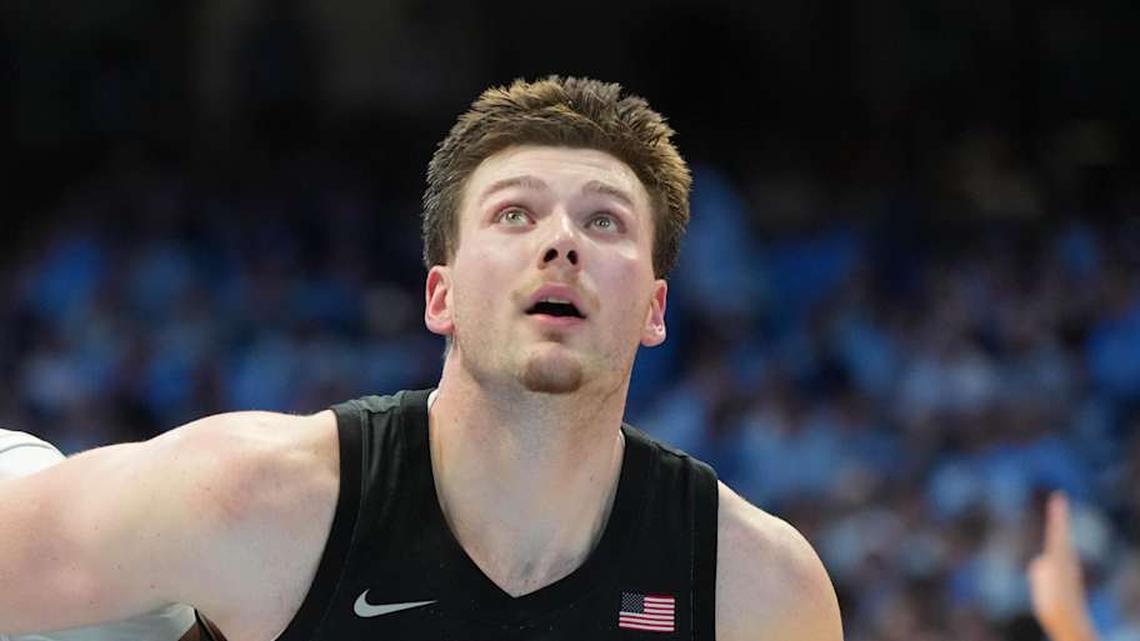  Feb 28, 2026; Chapel Hill, North Carolina, USA; Virginia Tech Hokies guard Jailen Bedford (0) and center Christian Gurdak (32) and North Carolina Tar Heels forward Jarin Stevenson (15) fight for a rebound in the second half at Dean E. Smith Center. Mandatory Credit: Bob Donnan-Imagn Images | Bob Donnan-Imagn Images 