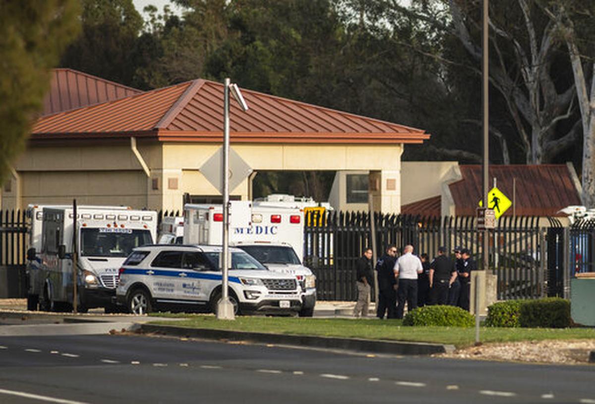 A group of ambulances from the Solano EMS Cooperative stage at the visitor center at Travis Air Force Base, adjacent to Fairfield, Calif., Sunday, Feb. 16, 2020. A group of Americans cut short a 14-day quarantine on the Diamond Princess cruise ship in the port of Yokohama, near Tokyo, to be whisked back to America. But they will have to spend another quarantine period at U.S. military facilities including Travis to make sure they don’t have the new virus that’s been sweeping across Asia.