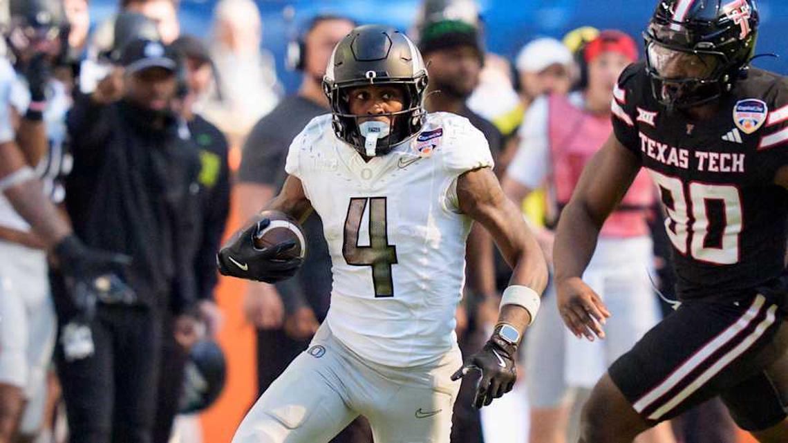  Oregon wide receiver Malik Benson takes off as the Oregon Ducks take on the Texas Tech Red Raiders in the Orange Bowl on Jan. 1, 2026, at Hard Rock Stadium in Miami, Florida. | Ben Lonergan/The Register-Guard / USA TODAY NETWORK via Imagn Images 