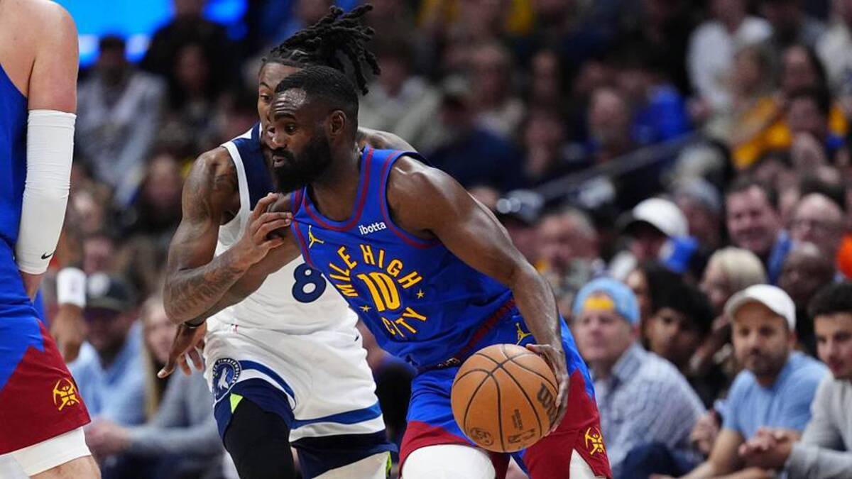  Apr 20, 2026; Denver, Colorado, USA; Minnesota Timberwolves guard Bones Hyland (8) defends on Denver Nuggets guard Tim Hardaway Jr. (10) in the first half during game two of the first round of the 2026 NBA Playoffs at Ball Arena. Mandatory Credit: Ron Chenoy-Imagn Images | Ron Chenoy-Imagn Images 