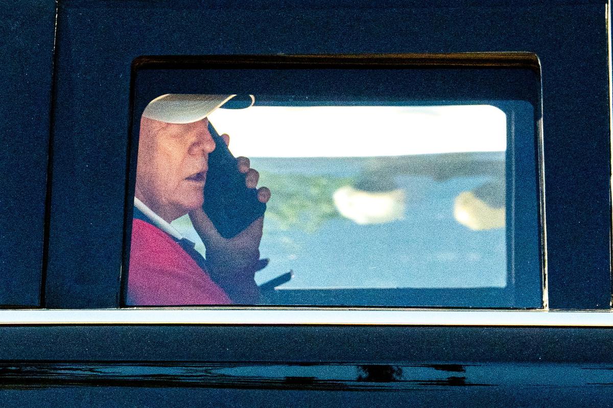U.S. President Donald Trump talks on the phone as he departs the White House for Trump National Golf Club in Sterling, Virginia, U.S., May 31, 2026. REUTERS/Aaron Schwartz