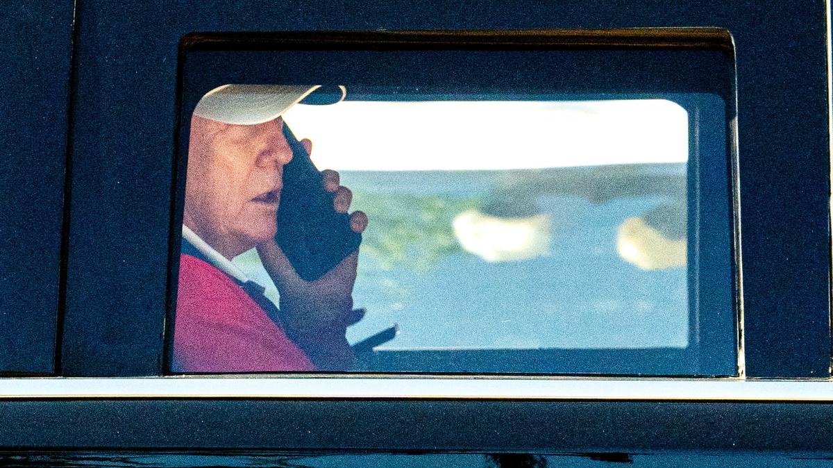 U.S. President Donald Trump talks on the phone as he departs the White House for Trump National Golf Club in Sterling, Virginia, U.S., May 31, 2026. REUTERS/Aaron Schwartz