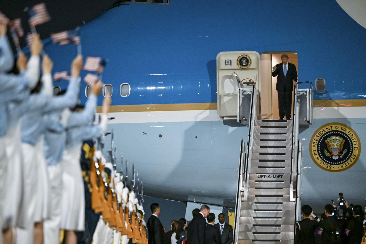 President Donald Trump gestures as he arrives at Beijing Capital International Airport in Beijing, China, on Wednesday, May 13, 2026, for a two-day summit with China's leader, Xi Jinping. (Kenny Holston/The New York Times)