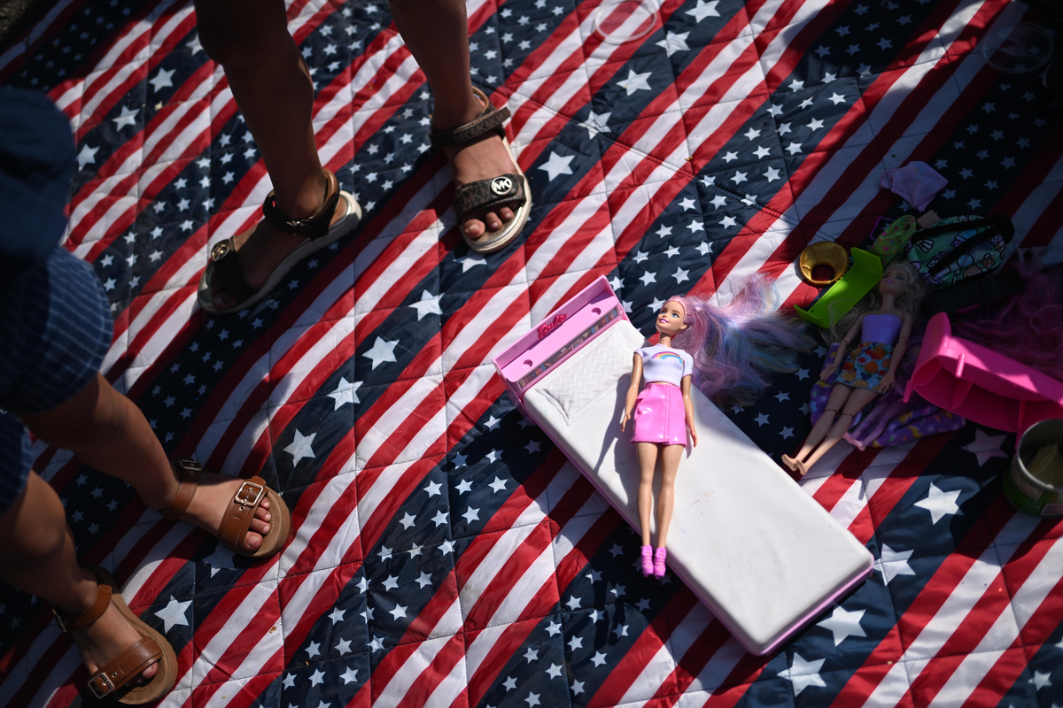 A Barbie doll lies on an attendee's blanket during the Greeley Stampede's Independence Day parade in Greeley, Colo., July 4, 2026. America celebrates the 250th anniversary of its independence today, with people from one end of the country to the other marking the milestone with fireworks, parades and concerts. (Mark Makela/The New York Times)