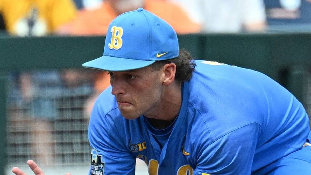  Jun 14, 2025; Omaha, Neb, USA; UCLA Bruins shortstop Roch Cholowsky (1) fields a ground ball against the Murray State Racers during the ninth inning at Charles Schwab Field. Mandatory Credit: Steven Branscombe-Imagn Images | IMAGN IMAGES via Reuters Connect 