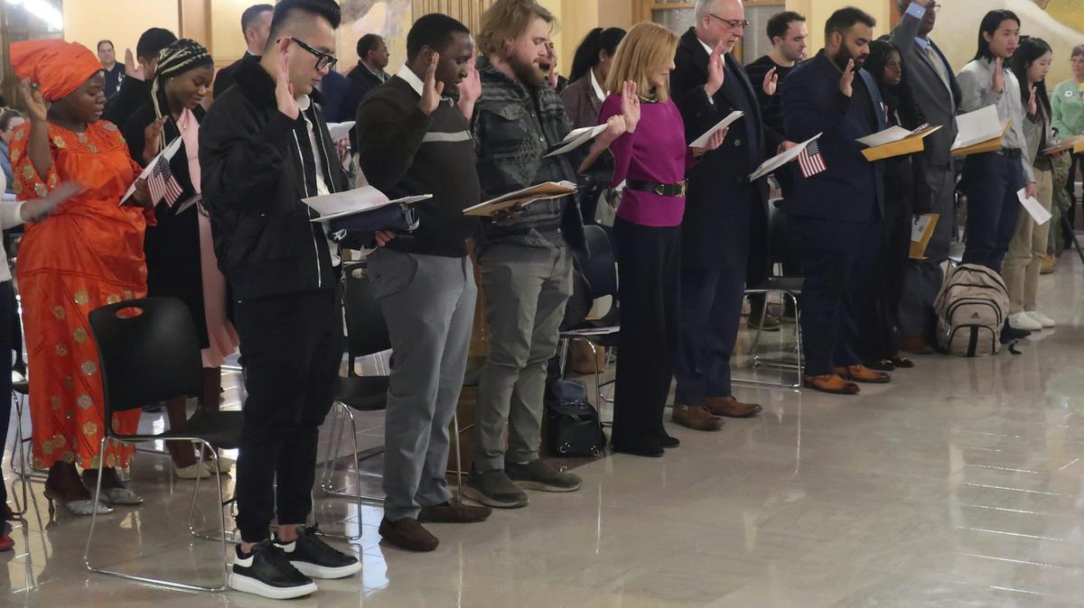 Dozens of immigrants from 18 nations take the oath to become U.S. citizens on Jan. 27, 2025, in Topeka, Kan. 